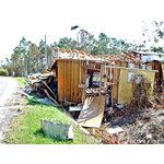 Damaged home west of Waveland, MS.