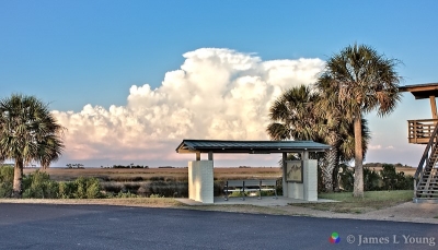 Thunderstorm forms backdrop to lighthouse bench. (6/7/2015) - St. Marks National Wildlife Refuge.